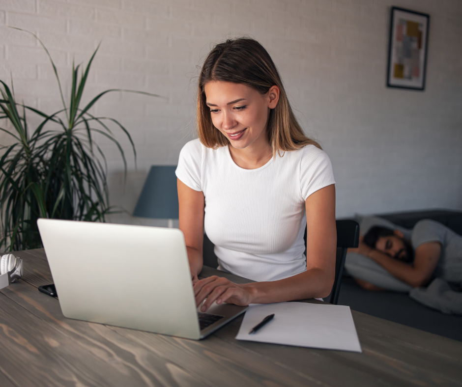 A model at her laptop, looking at courses