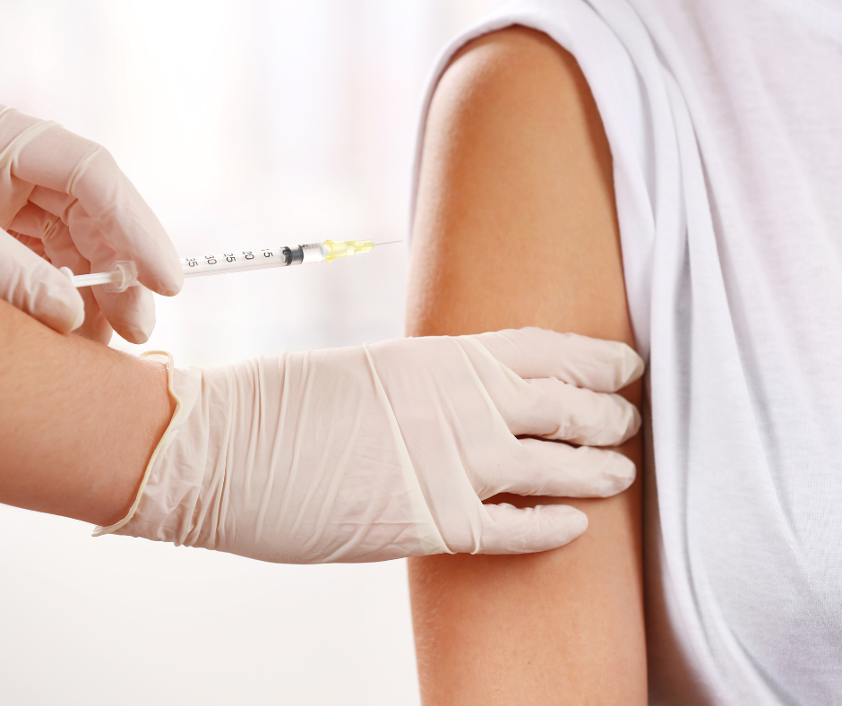 A Client receiving an injection for a booster by a trained practitioner.
